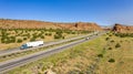 Vehicle Traffic moves along a Divided Highway in southwestern Desert Country Royalty Free Stock Photo