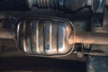 Vehicle underbody exhaust pipe, catalyst, resonator, exhaust system. Old parts require repair and replacement. Car service and