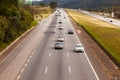 Vehicles on BR-374 highway with headlights on during the daylight obeying the new Brazilian transit laws