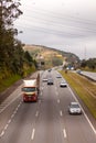 Vehicles on BR-374 highway with headlights on during the daylight obeying the new Brazilian transit laws