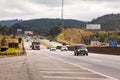 Vehicles on BR-374 highway with headlights on during the daylight obeying the new Brazilian transit laws