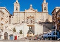 Vehicles driving past 16th century Immaculate Conception Church under sun Royalty Free Stock Photo