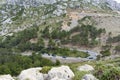 Vehicles driving on a winding serpentine road at Mirador Es Colomer in Cap de Formentor, Mallorca, Spain