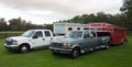 Pick-up trucks with horse trailers parked inside a paddock in florida