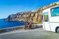 Vehicles moving on narrow winding road to Caldera Santorini island Greece