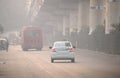 Vehicles moving in the road amidst heavy smog in Delhi