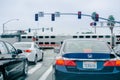 Vehicles waiting at a red traffic light