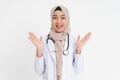 veiled female doctor raising hand on chin when smiling happily