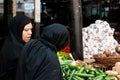 Veiled Muslim Egyptian Women buying the vegetable