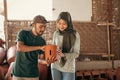 Veiled woman and man looking at the pottery Royalty Free Stock Photo