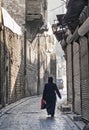 Veiled woman on old town street in aleppo syria