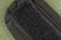 Velcro from clothes on a green background. Closeup Royalty Free Stock Photo