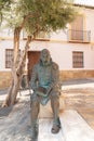 VELEZ-MALAGA, SPAIN - 17 AUGUST 2018 Bronze statue of Miguel de Cervantes, the author famous for the novels of Don Quixote, Velez-