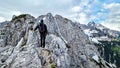 Velika Baba  - A hiking man with helmet on a hiking trail in the rocky sharp Kamnik Savinja Alps in Carinthia, Austria, Slovenia Royalty Free Stock Photo