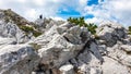 Velika Baba  - A hiking man with helmet on a hiking trail in the rocky sharp Kamnik Savinja Alps in Carinthia, Austria, Slovenia Royalty Free Stock Photo