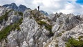 Velika Baba  - A hiking man with helmet on a hiking trail in the rocky sharp Kamnik Savinja Alps in Carinthia, Austria, Slovenia Royalty Free Stock Photo