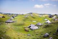 Velika planina plateau, Slovenia, Mountain village in Alps, wooden houses in traditional style, popular hiking Royalty Free Stock Photo