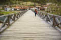 VELIKO TARNOVO, BULGARIA, 05 APRIL, 2015: Young woman cross the Bishop`s bridge , this is a 250 years old wooden bridge , a iconi