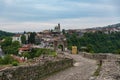 Entrance gate of Tsarevets Fortress and Veliko Tarnovo old town at background, Bulgaria Royalty Free Stock Photo