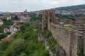 Gate tower and ruins of Tsarevets fortress with a view of the old town of Veliko Tarnovo in the background, Bulgaria