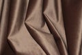 Velour background with drapery. Velour color of coffee with milk. Velour background with pleats