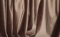 Velour background with drapery. Velour color of coffee with milk. Velour background with pleats