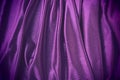 Velour fabric, similar to silk. Textiles in a folds and beautiful waves. Purple, pink, magenta shades on the drapery