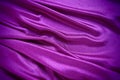 Velour fabric, similar to silk. Textiles in a folds and beautiful waves. Purple, pink, magenta shades on the drapery