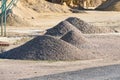 Velt conveyors and a piles of rubble in gravel quarry, crushed sand in different sizes