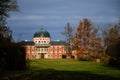 Veltrusy Rococo castle with park and garden, Romantic baroque chateau red with white windows in sunny autumn day, Central Bohemia Royalty Free Stock Photo