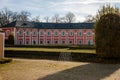 Veltrusy Rococo castle with park and garden, Romantic baroque chateau red with white windows in sunny autumn day, Central Bohemia Royalty Free Stock Photo