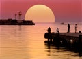 Velvet sunset in the port of Yalta, Ukraine. Pier and lighthouse. Royalty Free Stock Photo