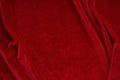 Velvet texture red color background, expensive luxury fabric,  wallpaper. Royalty Free Stock Photo