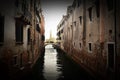 VEN, ITALY - Feb 09, 2016: A typical Venetian canal, with Venetian architecture on both sides reflecting in the canal\'s water