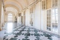 Venaria Reale, Italy - January 2023: luxury interior old royal palace. Gallery perspective with window