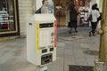 Vending Machine meter of car parking beside traffic road for people use at Shinjuku