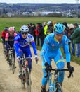 The Peloton on a Dirty Road - Paris-Nice 2016