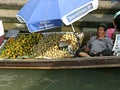 Vendor on the boat, Amphawa Market, Thailand.