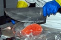 A vendor cutting fish at the Boqueria market