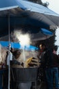 Vendor of prepared boiled corn and esquites