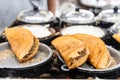 Vendor preparing traditional delicious apam balik or peanut pancake in food eatery Royalty Free Stock Photo