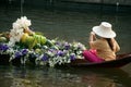 Vendor sell in floatig market, Bangkok, Thailand. Royalty Free Stock Photo