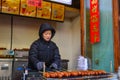 A vendor selling food on walking street