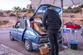 Vendor selling freshly ground coffee made from the trunk of a car