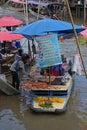 Vendor selling grilled fresh seafood in a floating market in Bangkok Thailand Royalty Free Stock Photo