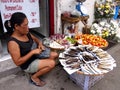 A vendor sells dried and smoked fish along a street in Antipolo City, Philippines