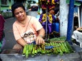 A vendor sells Tupig, a local delicacy made from glutenous rice Royalty Free Stock Photo