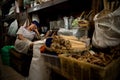 Vendor sleeps at her stall in a market in Yogyakarta on