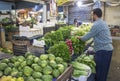 Vendor stacking fresh produce in Amman Jordan
