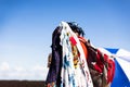 Vendor walking on the beach and selling sarongs at the Porto da Barra beach in Salvador, Brazil